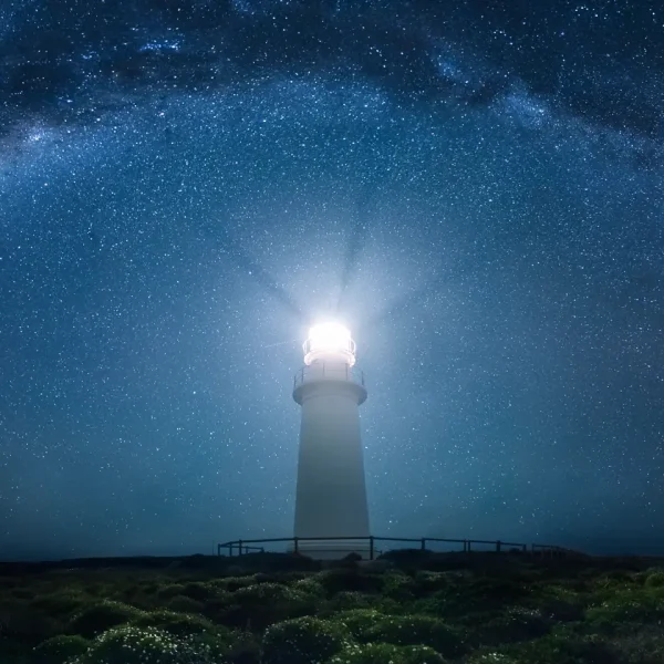 lighthouse-and-night-sky-with-stars-on-coastline-2026-03-16-01-08-15-utc